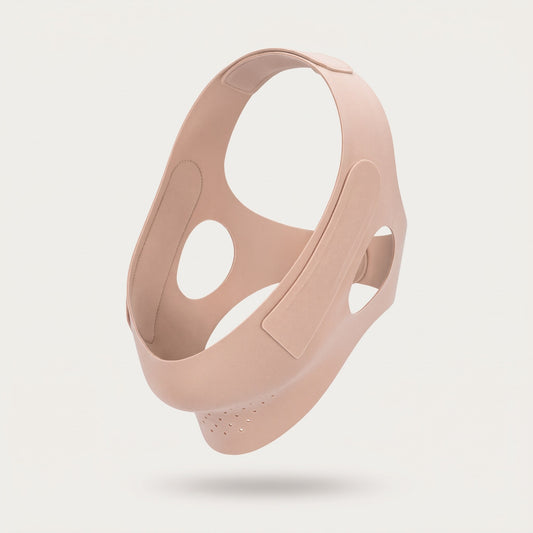 Nude soft-fabric facial wrap holding its worn shape on a pale studio background