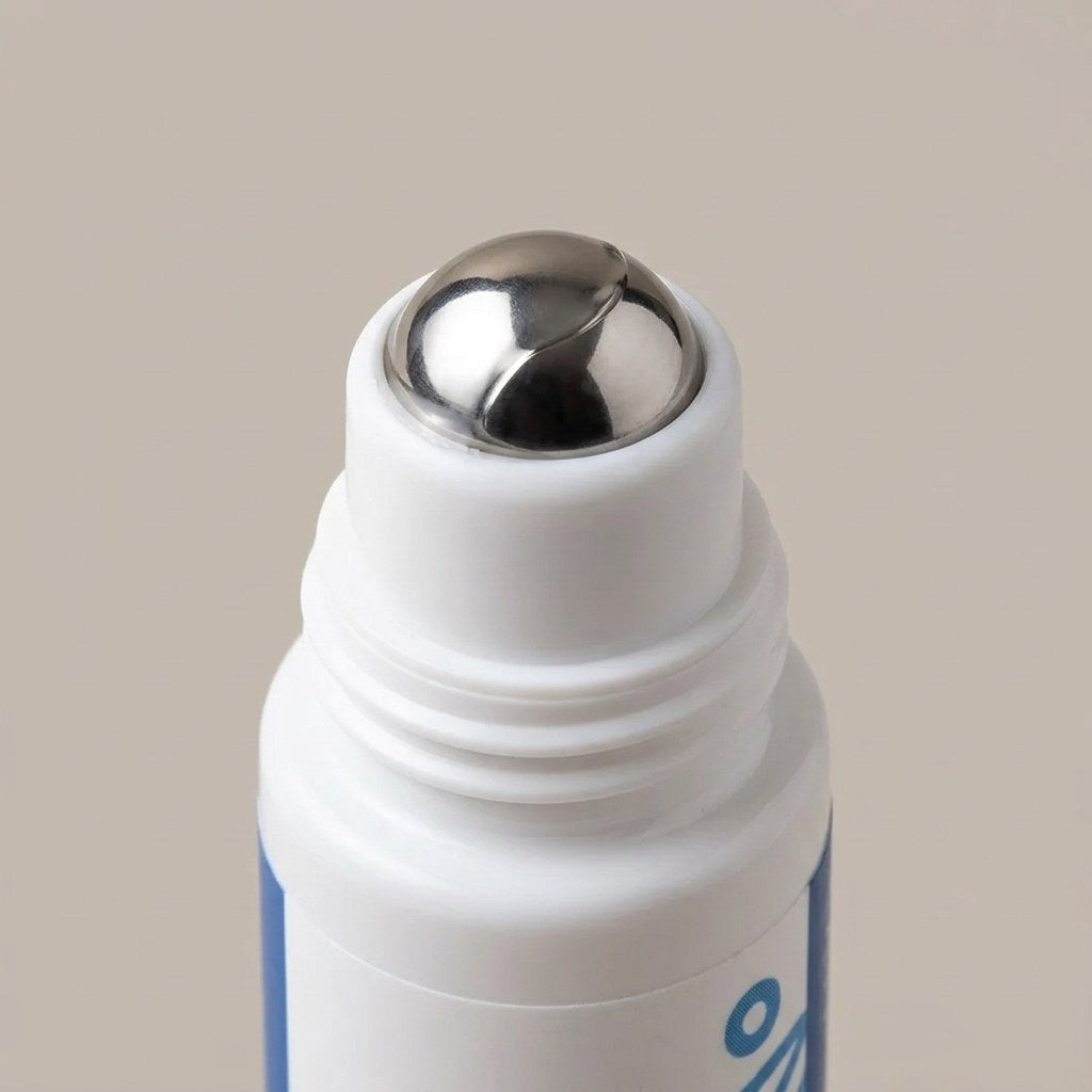 Close view of the bottle's polished stainless steel roller ball