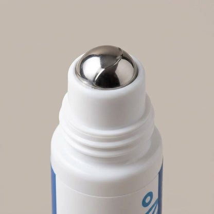 Close view of the bottle's polished stainless steel roller ball