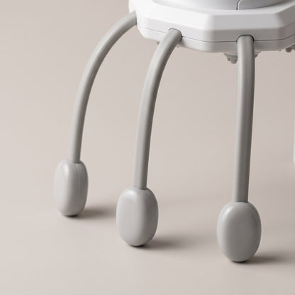 Close view of three of the scalp massager's legs and their rounded tips