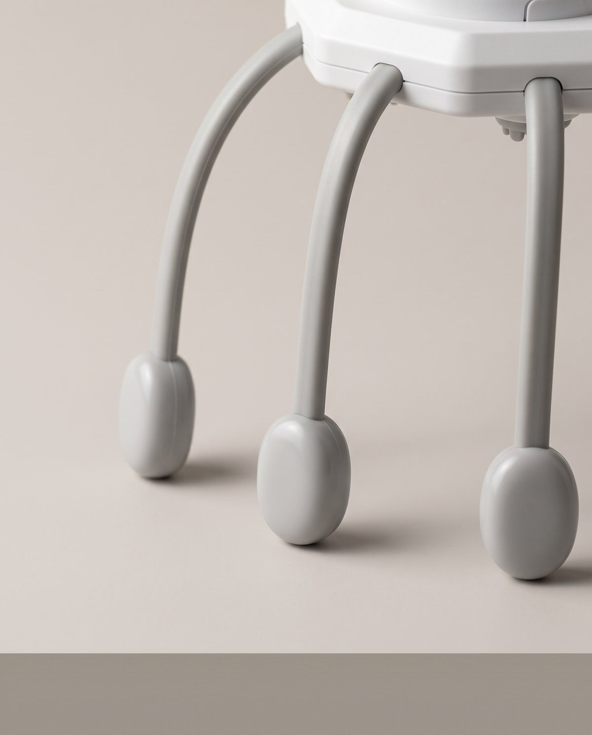 Close view of the scalp massager's flexible legs