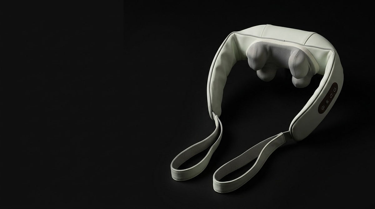 The neck and shoulder massager lit against a black background
